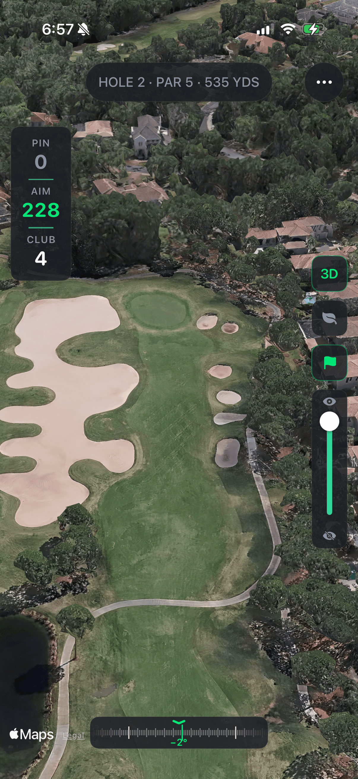 Aerial view of the same Par 5 hole on the real course — fairway, sand bunkers, and green.