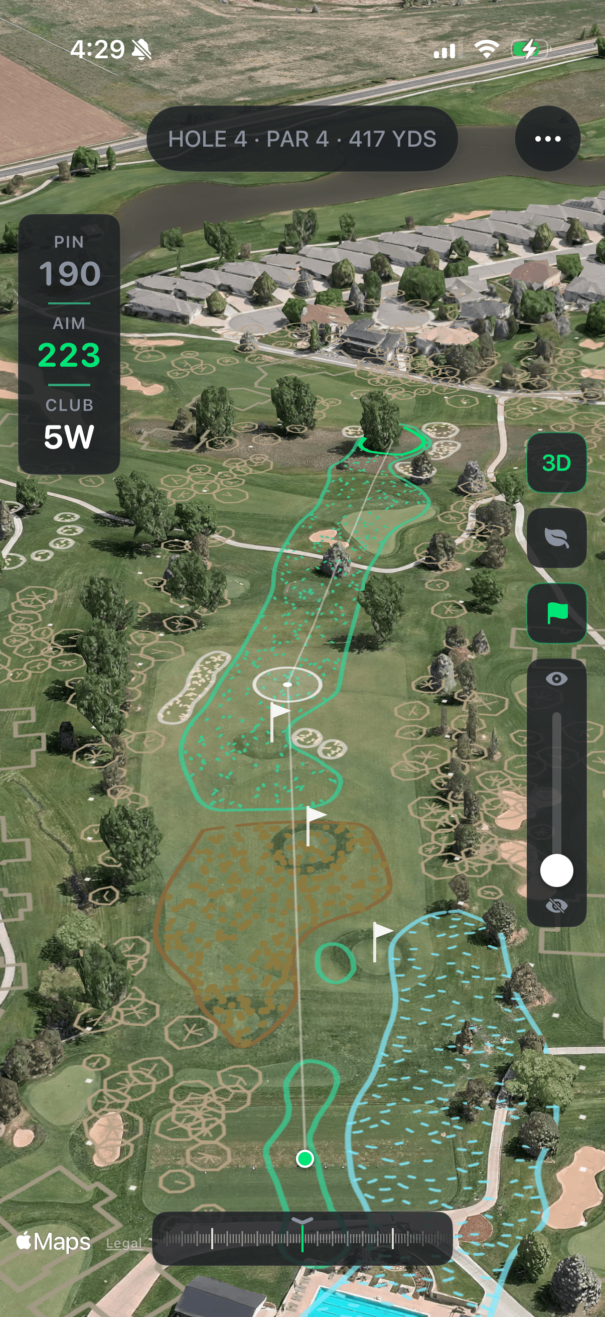 A par 4 hole projected onto a driving range, showing fairway outlines and a pin yardage card.